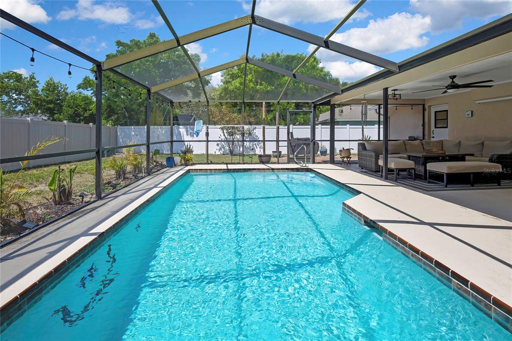 14154 Trollman Street Spring Hill, FL 34609 - Photo 24 of 25 a view of swimming pool with a patio