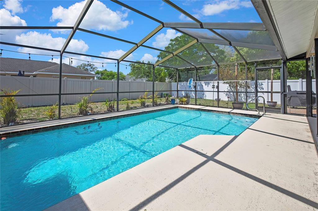 14154 Trollman Street Spring Hill, FL 34609 - Photo 25 of 25 a view of a backyard with swimming pool