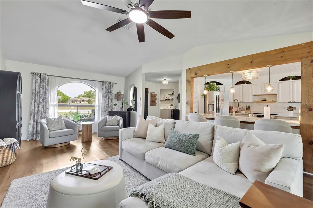 14154 Trollman Street Spring Hill, FL 34609 - Photo 3 of 25 a living room with furniture or couches and a large window
