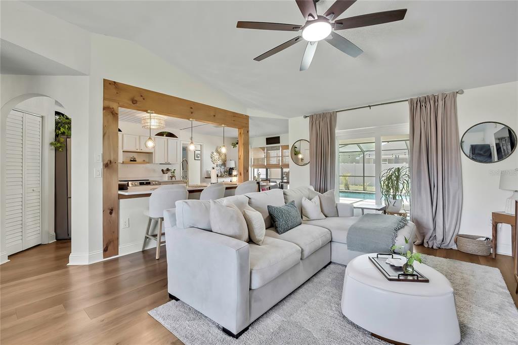 14154 Trollman Street Spring Hill, FL 34609 - Photo 4 of 25 a living room with furniture and a large window