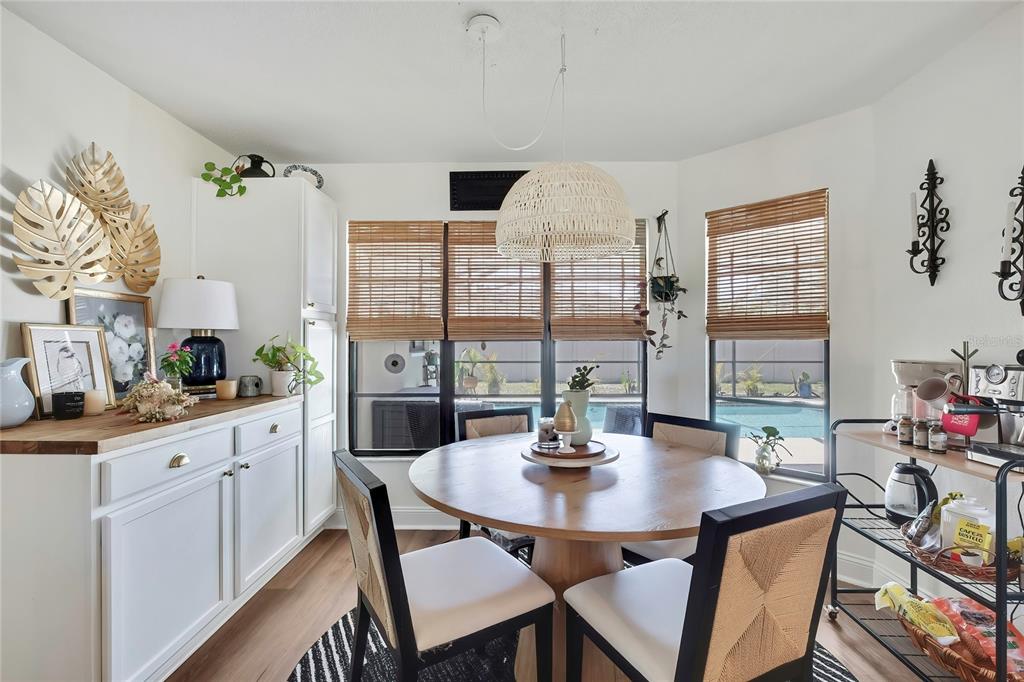 14154 Trollman Street Spring Hill, FL 34609 - Photo 10 of 25 a view of a dining room with furniture and window