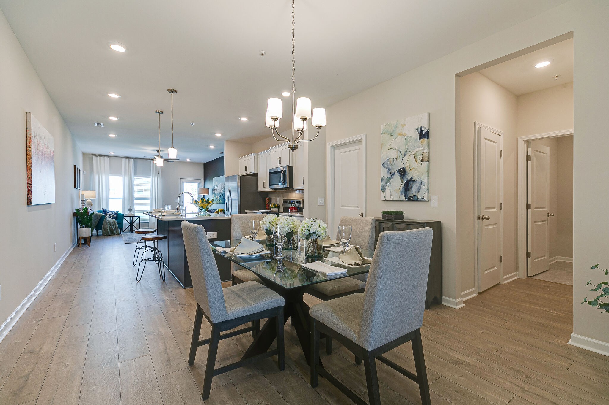 1070 June Wilde Ridge Spring Hill, TN 37174 - Photo 6 of 28 a view of a dining room and livingroom with furniture wooden floor a chandelier