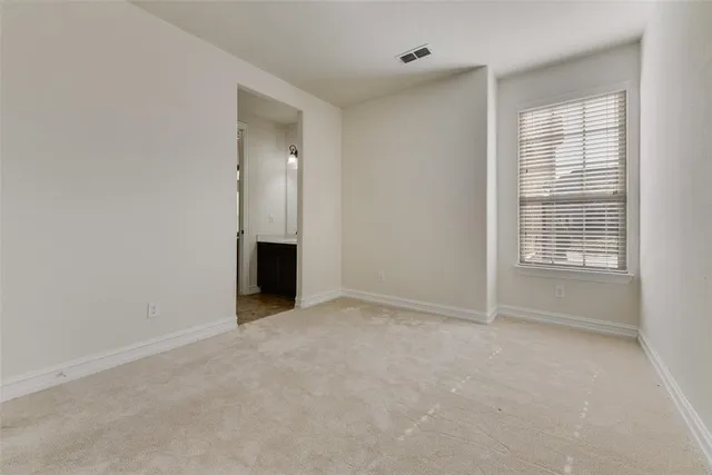 an empty room with an empty space and a window