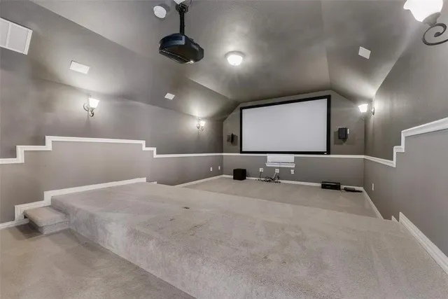 a bathroom with a sink a large mirror and shower