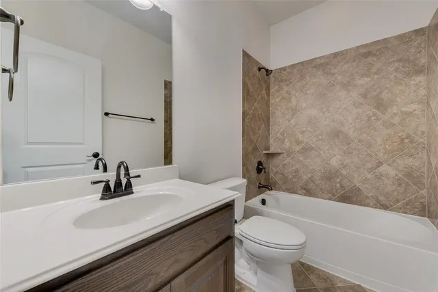 a bathroom with a sink a toilet and a bathtub