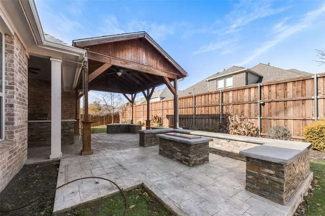 an outdoor sitting area with furniture