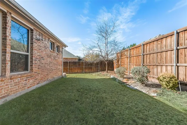 a view of backyard with green space