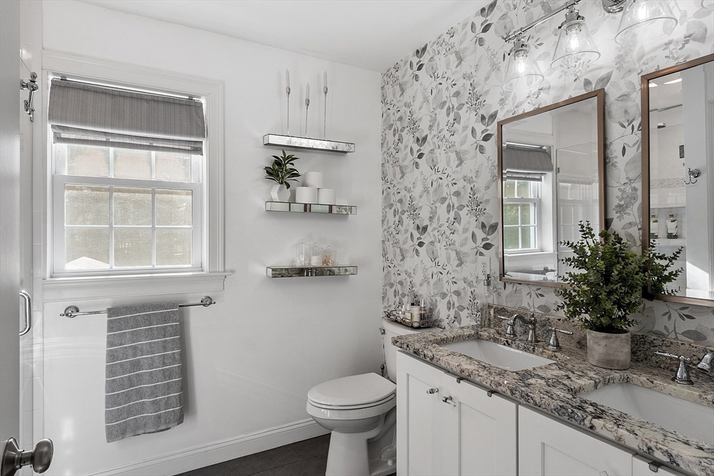 75 Chestnut Street Foxboro, MA 02035 - Photo 11 of 30 a bathroom with a granite countertop sink a toilet and a mirror