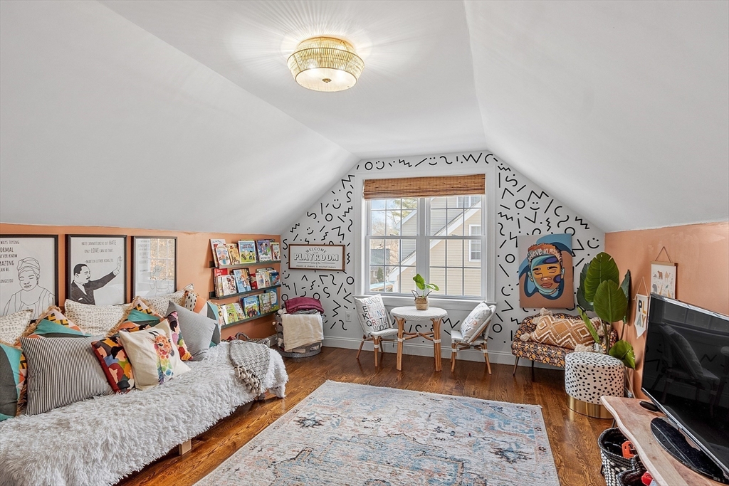 75 Chestnut Street Foxboro, MA 02035 - Photo 19 of 30 a living room with furniture and a flat screen tv