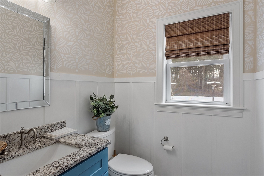 75 Chestnut Street Foxboro, MA 02035 - Photo 20 of 30 a bathroom with a granite countertop sink and a mirror