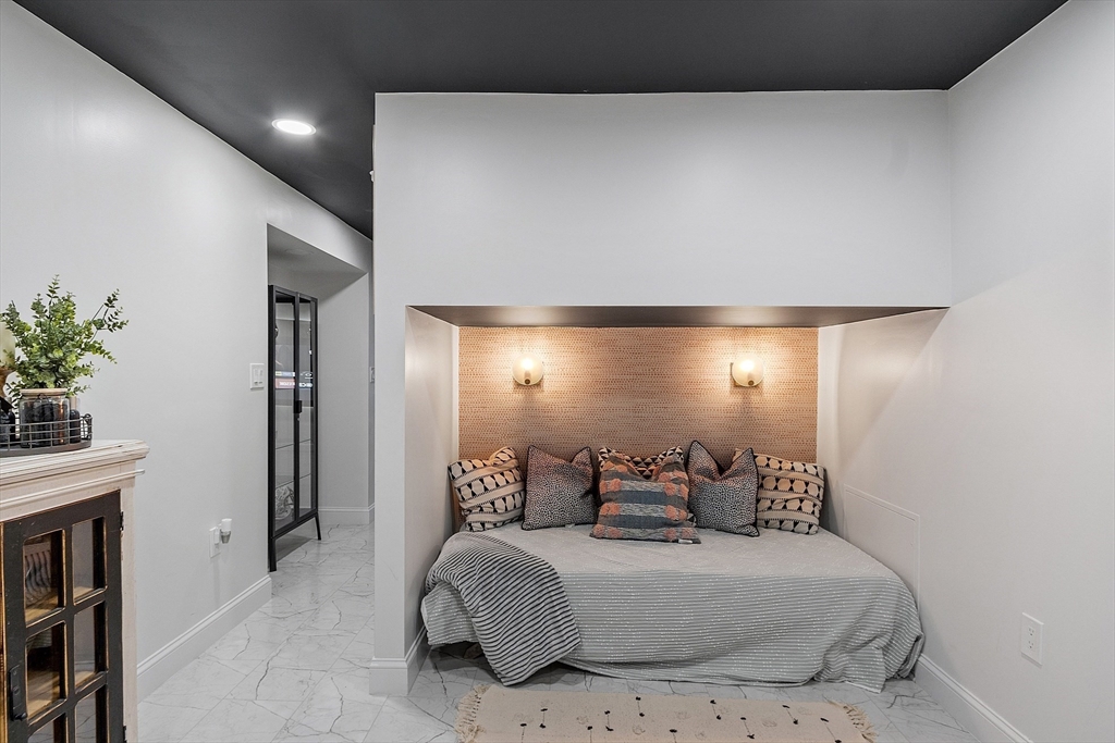 75 Chestnut Street Foxboro, MA 02035 - Photo 24 of 30 a spacious bedroom with a bed and a potted plant