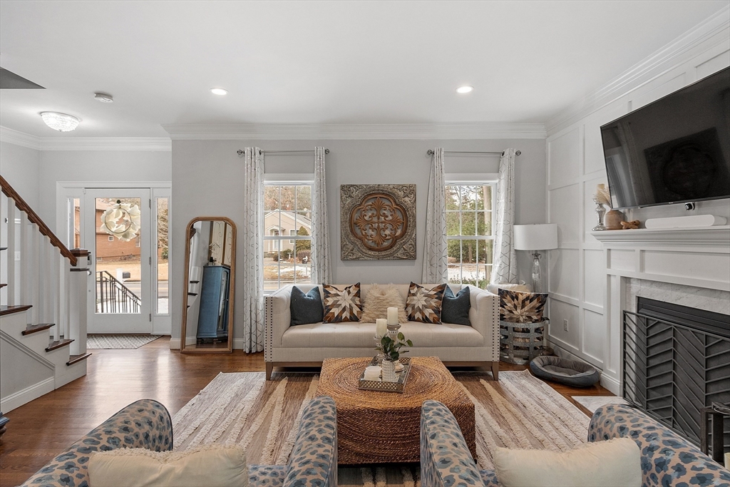 75 Chestnut Street Foxboro, MA 02035 - Photo 3 of 30 a living room with fireplace furniture and a flat screen tv
