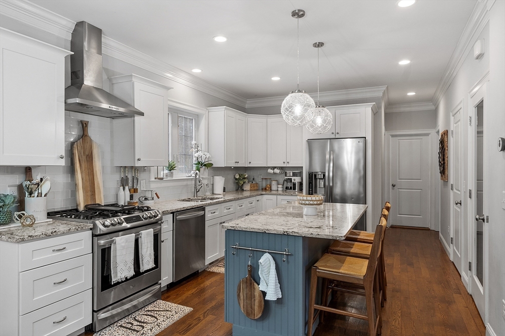 75 Chestnut Street Foxboro, MA 02035 - Photo 5 of 30 a kitchen with kitchen island granite countertop a sink stainless steel appliances and cabinets