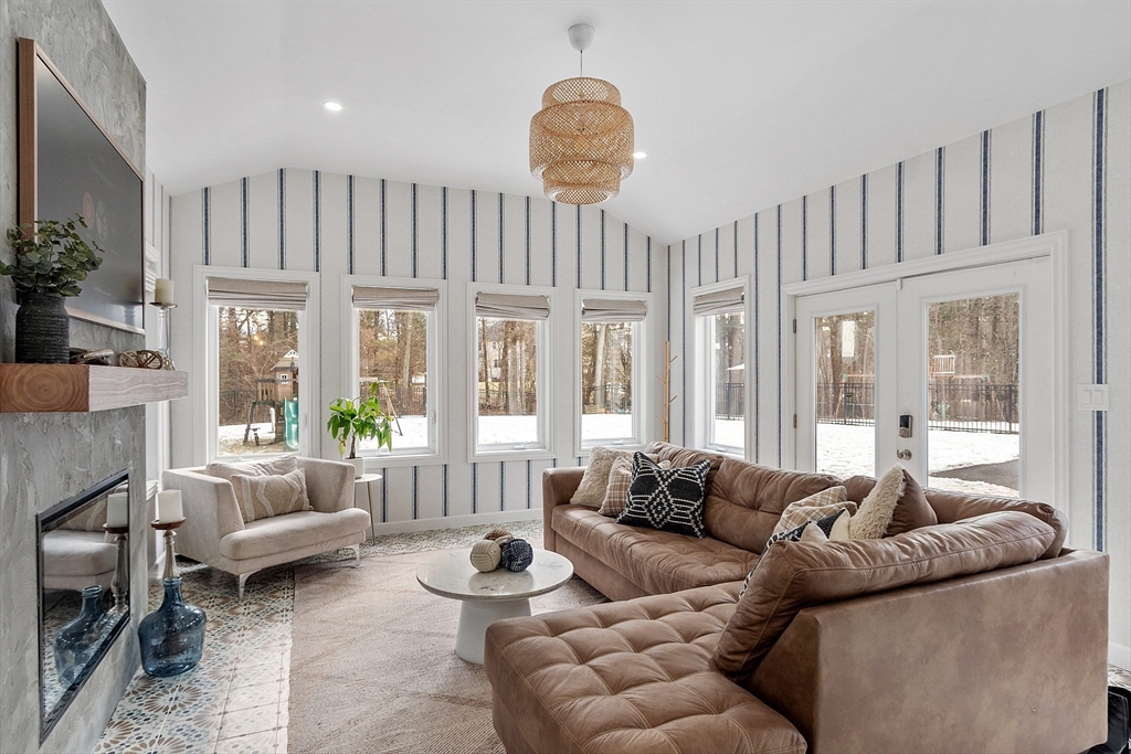 75 Chestnut Street Foxboro, MA 02035 - Photo 7 of 30 a living room with furniture a large window and a chandelier
