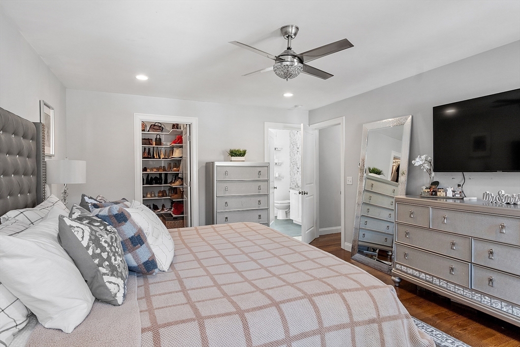 75 Chestnut Street Foxboro, MA 02035 - Photo 9 of 30 a bedroom with a bed and a flat screen tv