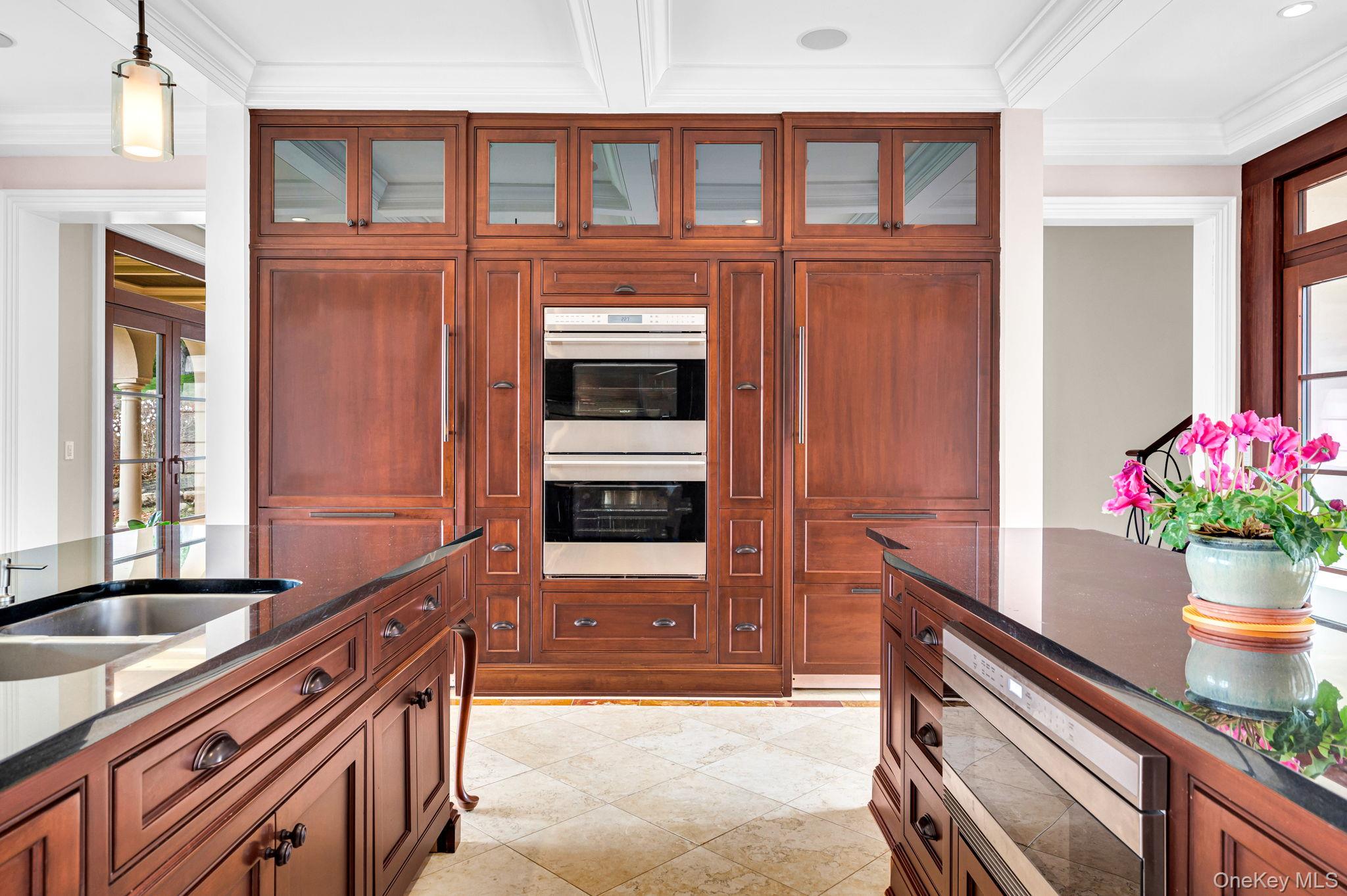 717 A Short Beach Road St. James, NY 11780 - Photo 16 of 50 a kitchen with stainless steel appliances granite countertop a sink and a refrigerator
