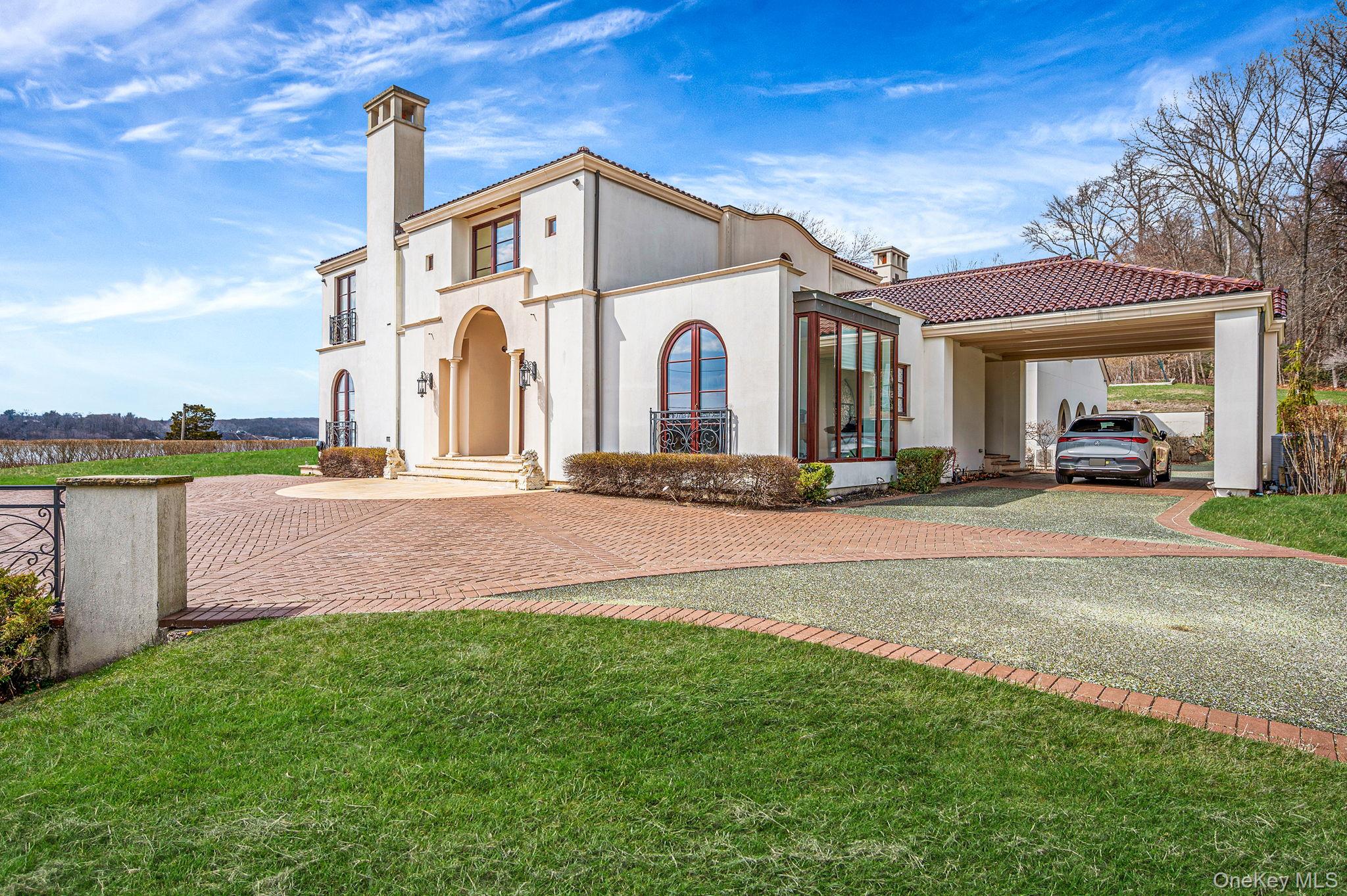 717 A Short Beach Road St. James, NY 11780 - Photo 2 of 50 Mediterranean/Spanish-Style Home Featuring a Carport, Stucco Siding, and Eco-friendly Recycled Glass Driveway