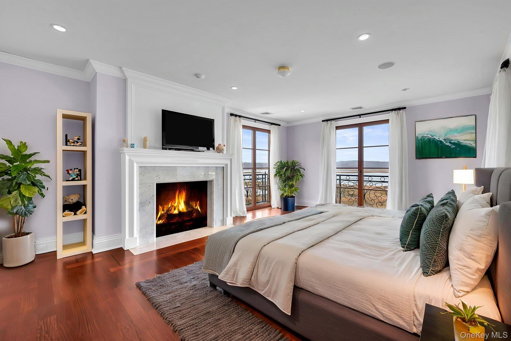 717 A Short Beach Road St. James, NY 11780 - Photo 29 of 50 a bedroom with a bed and a fireplace