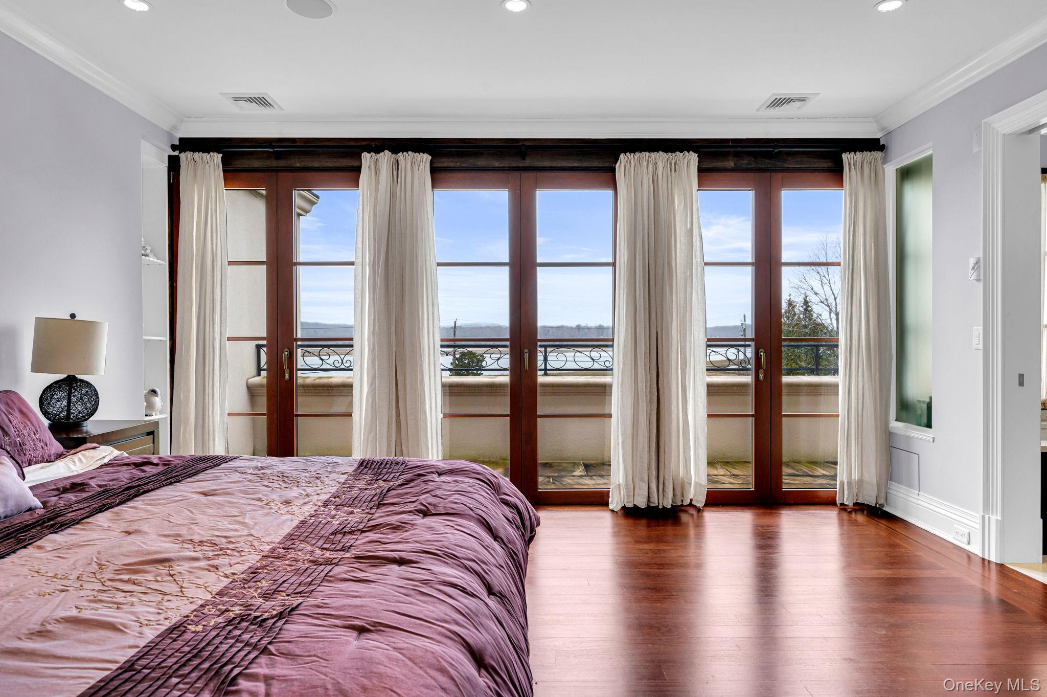 717 A Short Beach Road St. James, NY 11780 - Photo 33 of 50 a bedroom with a large bed and a large window