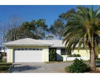 403 Peppertree Road Venice, FL 34293 - Photo 1 of 1 a front view of a house with a garden
