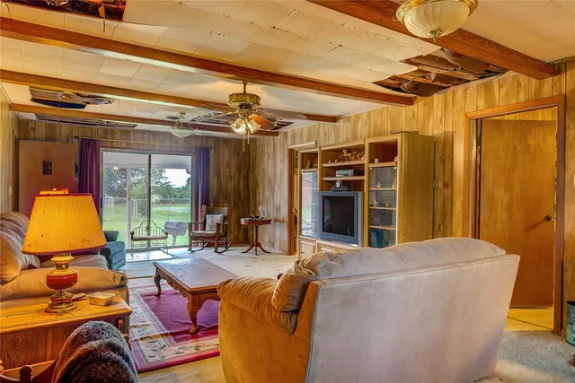 a view of living room with furniture and chandelier