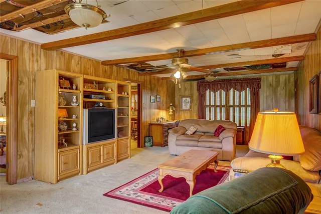 a bedroom with a bed and a mirror