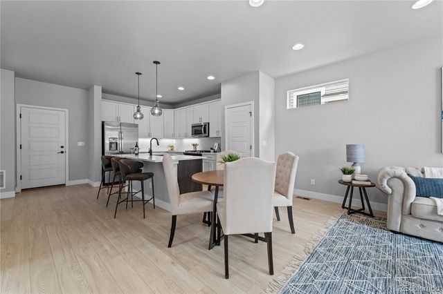 a view of a dining room with furniture
