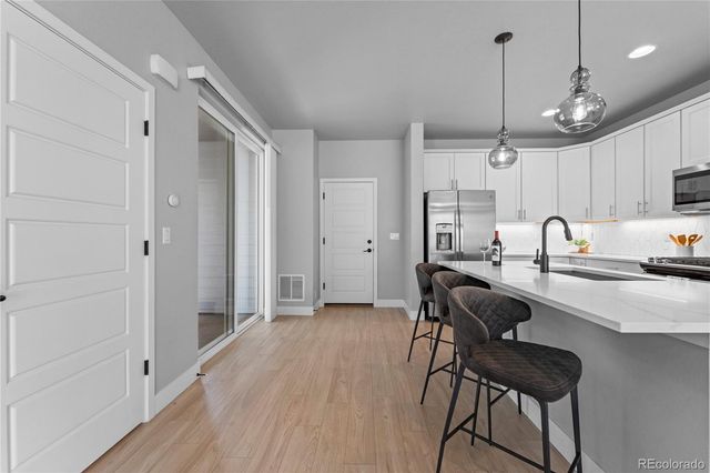 a view of a kitchen and dining room