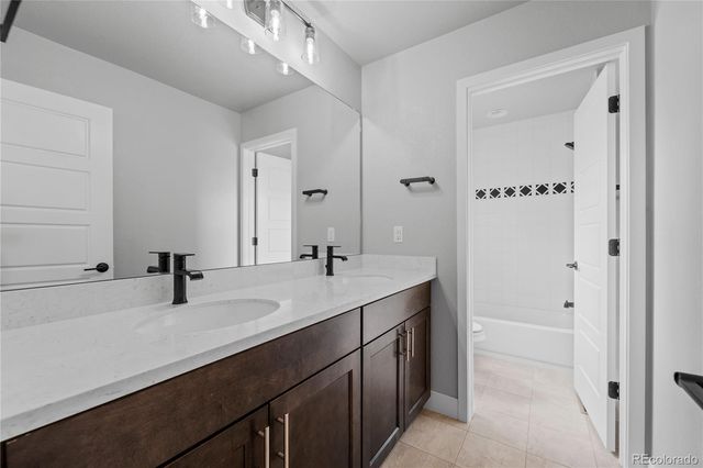 an empty room with a hallway and stairs