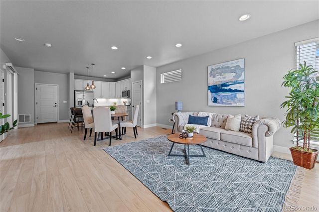 a living room with furniture and a table