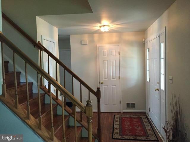 19 Markham Way Stafford, VA 22556 - Photo 2 of 23 a view of an entryway with wooden floor and stairs