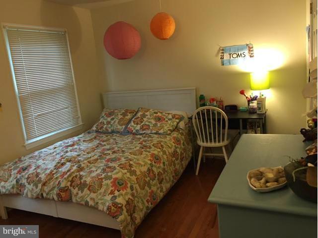 19 Markham Way Stafford, VA 22556 - Photo 11 of 23 a bed sitting in a bedroom next to a window and dresser