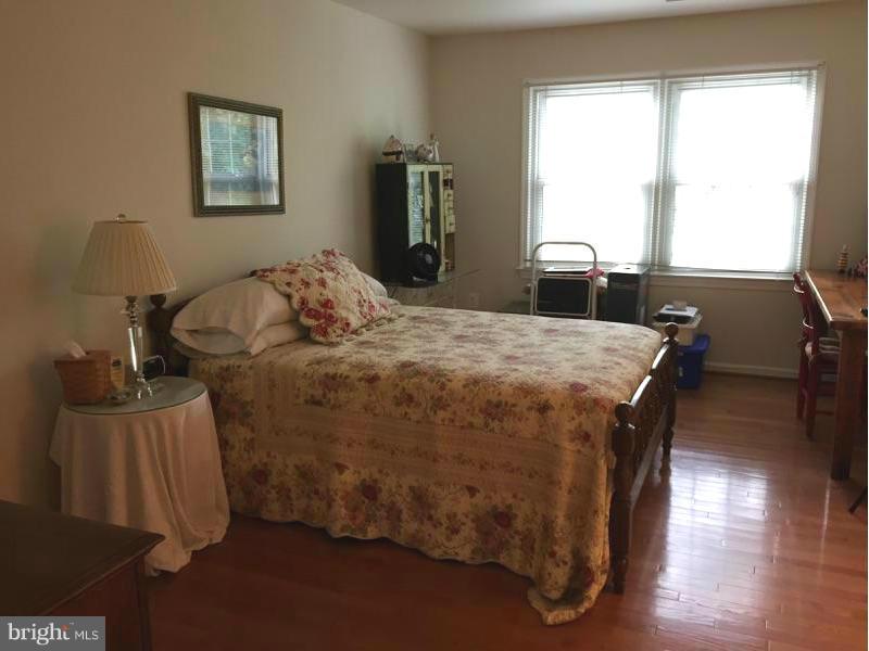 19 Markham Way Stafford, VA 22556 - Photo 12 of 23 a bed sitting in a bedroom next to a window