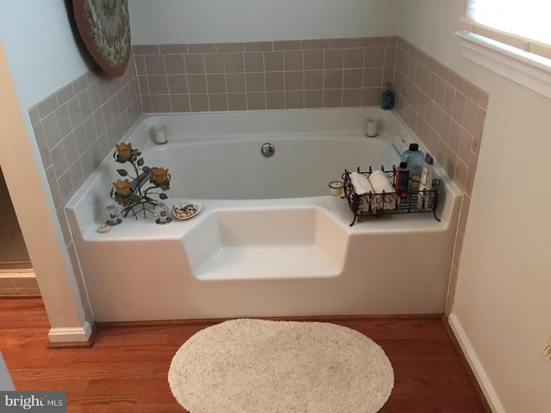 19 Markham Way Stafford, VA 22556 - Photo 16 of 23 a bathroom with a sink and a tub