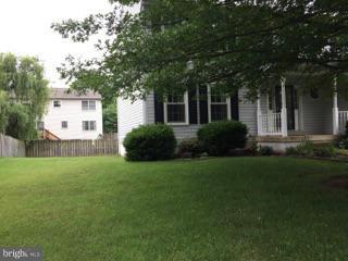 19 Markham Way Stafford, VA 22556 - Photo 20 of 23 a front view of a house with garden
