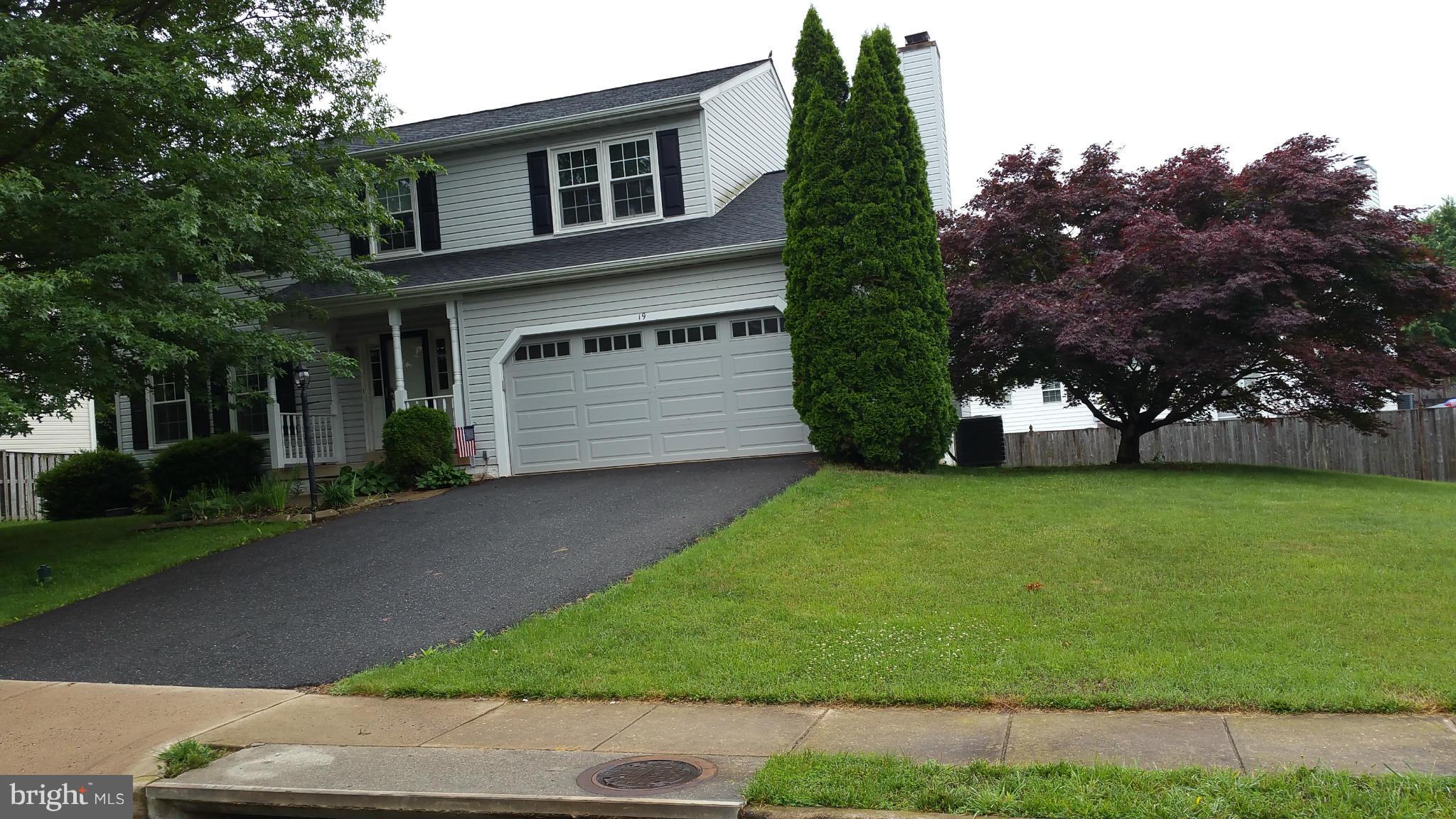 19 Markham Way Stafford, VA 22556 - Photo 22 of 23 a front view of a house with a garden