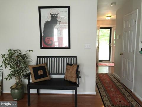 19 Markham Way Stafford, VA 22556 - Photo 6 of 23 a view of a hallway with wooden floor and a potted plant