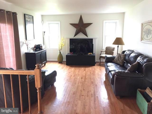19 Markham Way Stafford, VA 22556 - Photo 7 of 23 a living room with furniture and a fireplace