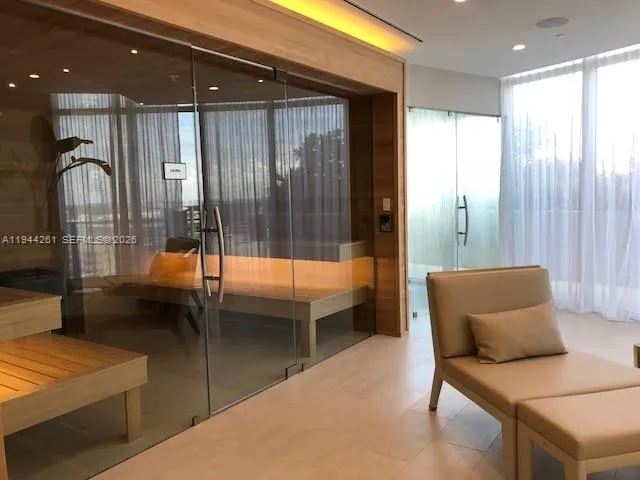 a balcony with table and chairs