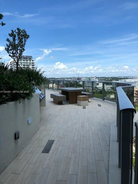 488 Northeast 18th Street, Unit 3703 Miami, FL 33132 - Photo 15 of 27 a view of a terrace with furniture