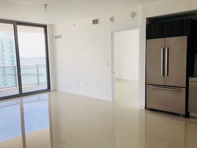 a white refrigerator freezer and a dishwasher sitting in a kitchen
