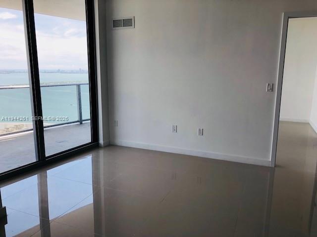 488 Northeast 18th Street, Unit 3703 Miami, FL 33132 - Photo 3 of 27 a view of a window in an empty room