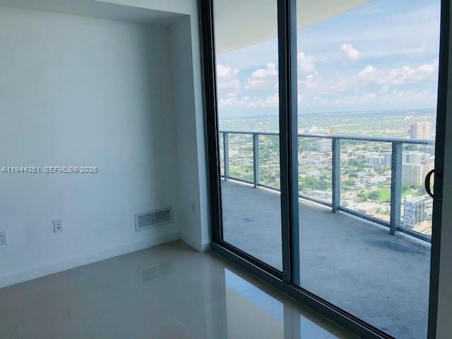 488 Northeast 18th Street, Unit 3703 Miami, FL 33132 - Photo 6 of 27 wooden floor in an empty room