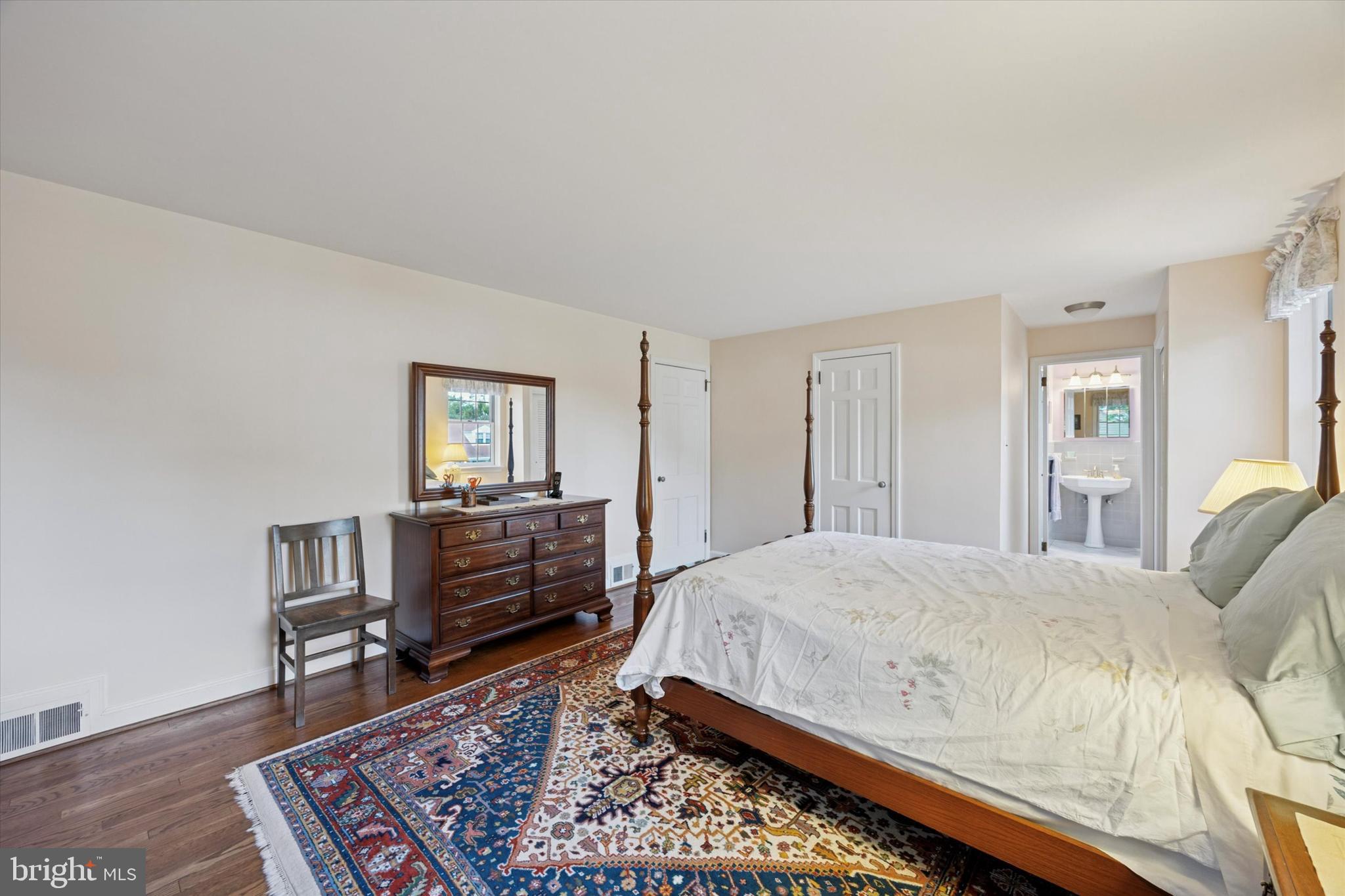 1208 Bruce Road Wilmington, DE 19803 - Photo 22 of 38 a bedroom with a bed and wooden floor