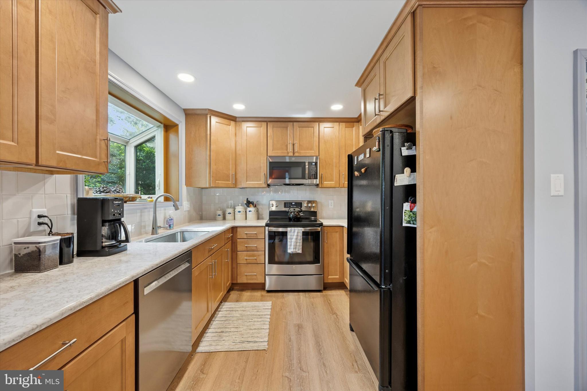 1208 Bruce Road Wilmington, DE 19803 - Photo 10 of 38 a kitchen with stainless steel appliances granite countertop a refrigerator and a sink