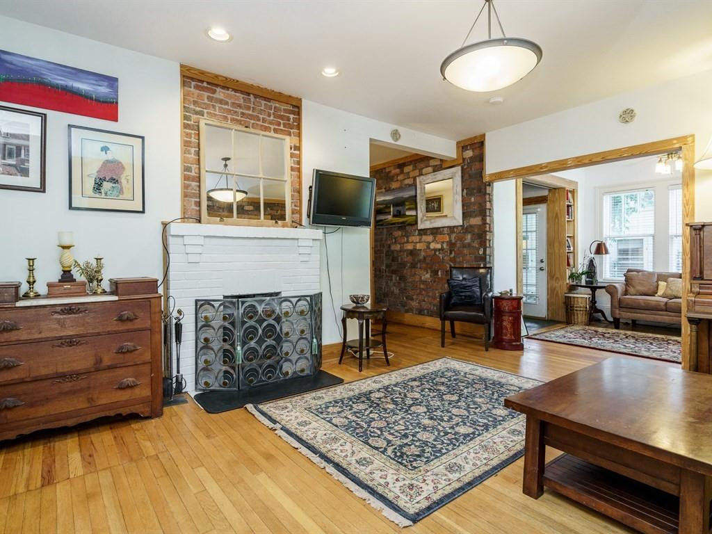 Natural wood trim was added throughout that blends nicely with the warmth of the exposed brick.