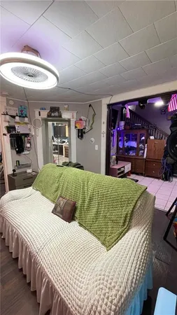 a bedroom with a bed a desk and chair