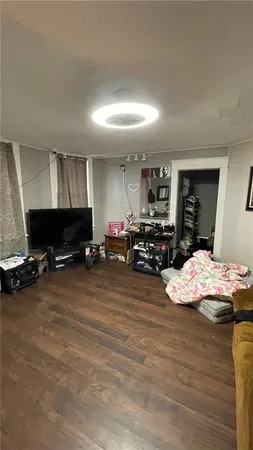 a room with furniture and a flat screen tv