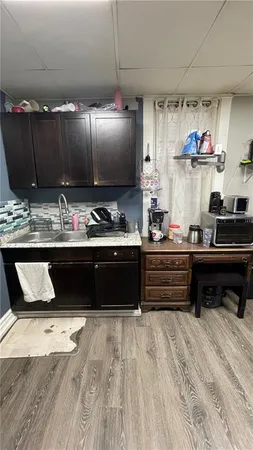 a kitchen with a sink and cabinets