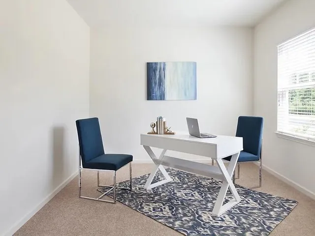 a workspace with furniture and window